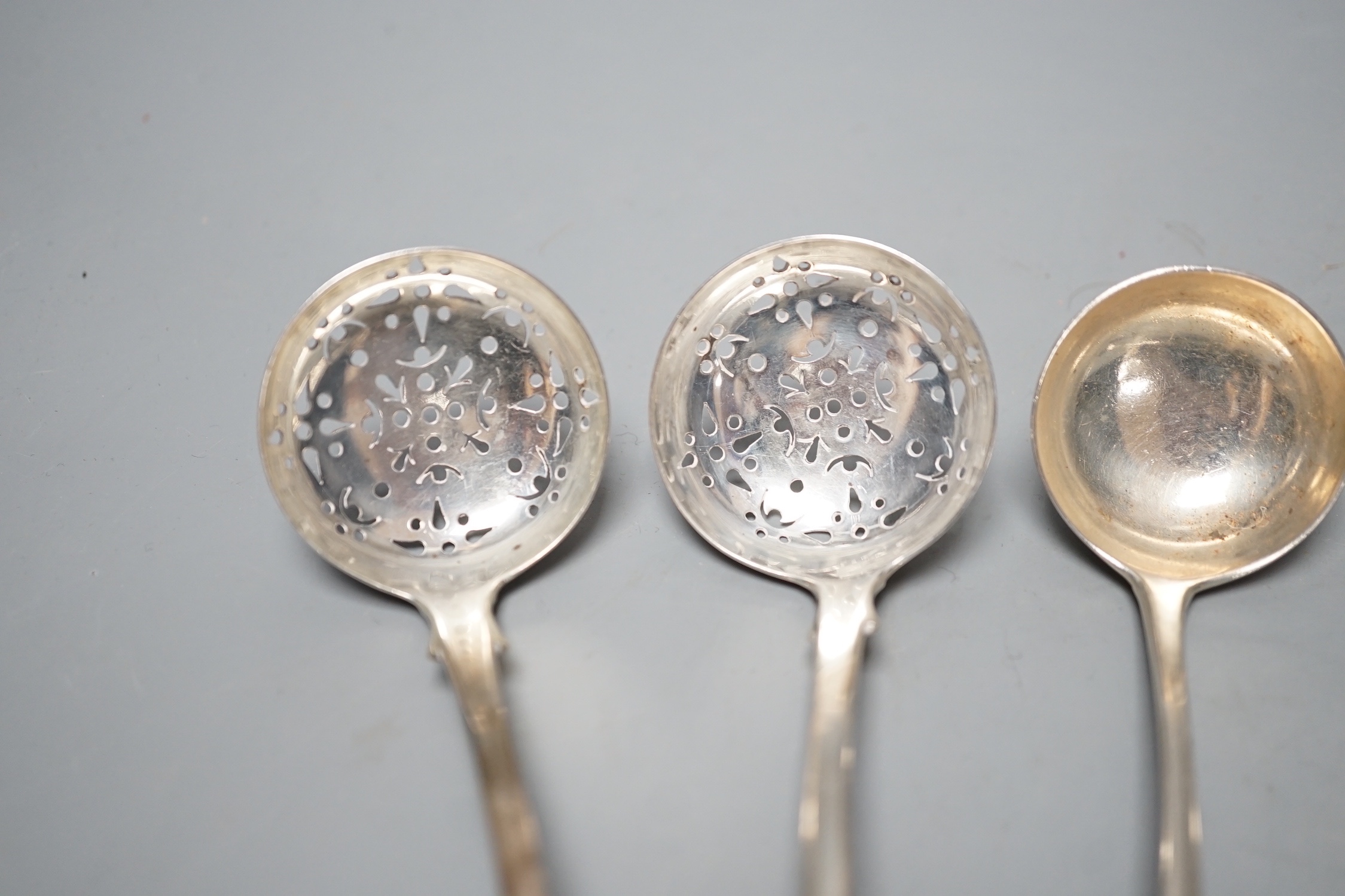 A pair of George III Scottish silver Old English pattern sauce ladles, Edinburgh, 1812, 16cm and a pair of Victorian Scottish silver fiddle pattern sifter spoons, Edinburgh, 1850, 122 grams.